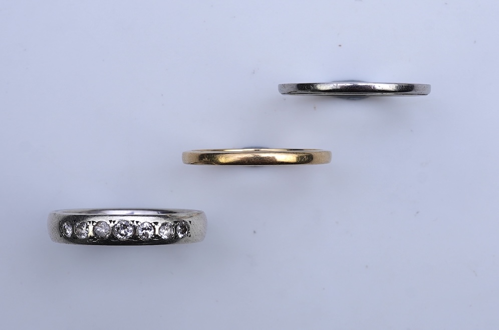 A diamond ring and two gold wedding rings